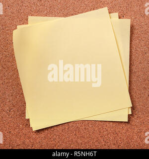 Several untidy sticky post notes on cork board Stock Photo