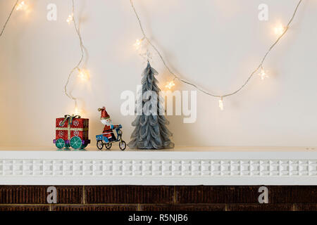 Christmas decorations on mantelpiece Stock Photo