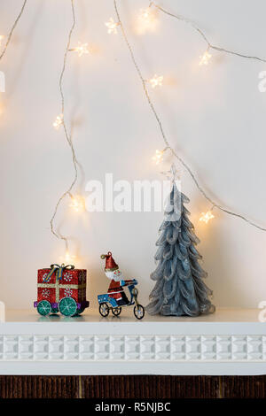 Christmas decorations on mantelpiece Stock Photo