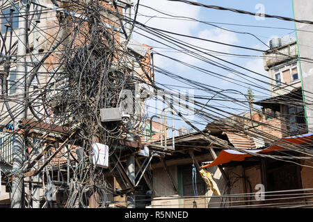 Utility pole with lots of entangled wires, Kathmandu, Nepal Stock Photo