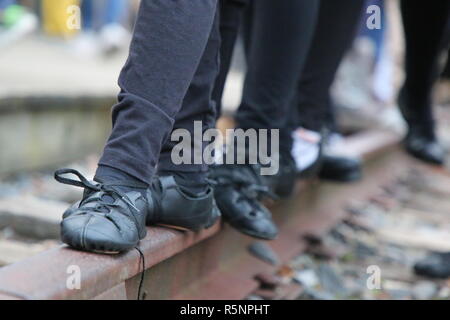 Irish Step Dancers stand on Railroad Tracks Stock Photo