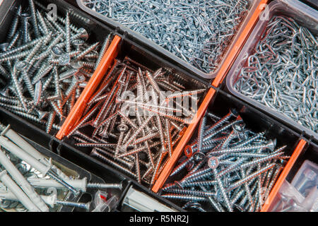 Screws and nails in a box Stock Photo