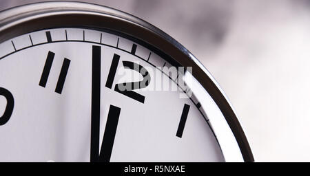 Wall clock showing five to twelve Stock Photo