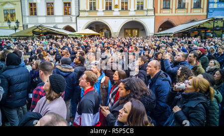 PRAGUE, CZECH REPUBLIC - DECEMBER 31, 2017 - Big crowd looking at the clock tower in Prague, Czechia. People taking pictures and videos when the clock Stock Photo