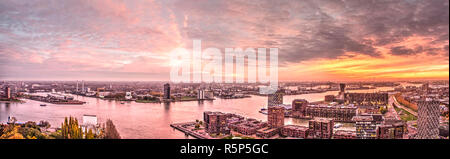 Rotterdam, The Netherlands, November 12, 2018: spectacular sunset sky over the river Nieuwe Maas and the adjacent harbour and residential areas Stock Photo