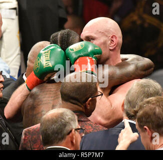 Los Angeles, California, USA. 1st December, 2018. Both fighters Deontay Wilder and Tyson Fury show respect to each other after going 12 rounds at the Staple Center Saturday. The fight was draw between both fighters from the judges scoring . Los Angeles, CA. Dec 1, 2018.Photo by Gene Blevins/ZumaPress Credit: Gene Blevins/ZUMA Wire/Alamy Live News Credit: ZUMA Press, Inc./Alamy Live News Stock Photo