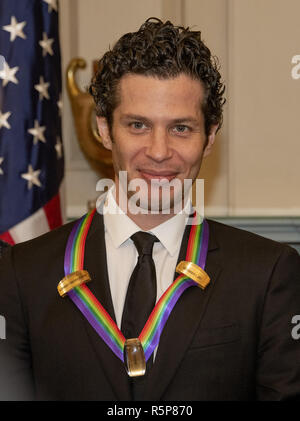 December 1, 2018 - Washington, District of Columbia, U.S. - Thomas Kail, one of the special honorees for Groundbreaking Work on Hamilton, as he poses with the recipients of the 41st Annual Kennedy Center Honors pose for a group photo following a dinner hosted by United States Deputy Secretary of State John J. Sullivan in their honor at the US Department of State in Washington, DC on Saturday, December 1, 2018. The 2018 honorees are: singer and actress Cher; composer and pianist Philip Glass; Country music entertainer Reba McEntire; and jazz saxophonist and composer Wayne Shorter. This year, Stock Photo