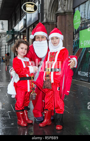 Liverpool, Merseyside, UK. 2nd December 2018. BTR Liverpool Santa Dash. People across Merseyside celebrate the  return of the UK’s biggest festive 5K fun run. The festive event has  continued to grow  with up to 10,000 runners, red, blue and mini Santas taking part this year.  The route took the Dashing Santas through the city centre, before they crossed the finish line outside Town Hall, where they were greeted by myriad of festive characters. Credit: Cernan Elias/AlamyLiveNews. Stock Photo