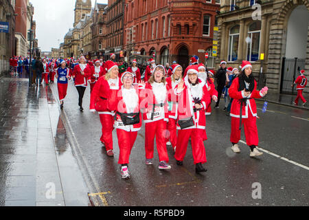 Liverpool, Merseyside, UK. 2nd December 2018. BTR Liverpool Santa Dash. People across Merseyside celebrate the  return of the UK’s biggest festive 5K fun run. The festive event has  continued to grow  with up to 10,000 runners, red, blue and mini Santas taking part this year.  The route took the Dashing Santas through the city centre, before they crossed the finish line outside Town Hall, where they were greeted by myriad of festive characters. Credit: Cernan Elias/AlamyLiveNews. Stock Photo