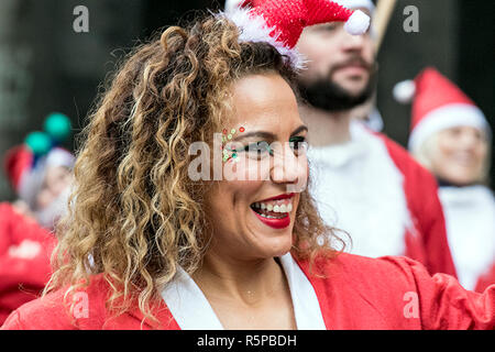 Liverpool, Merseyside, UK. 2nd December 2018. BTR Liverpool Santa Dash. People across Merseyside celebrate the  return of the UK’s biggest festive 5K fun run. The festive event has  continued to grow  with up to 10,000 runners, red, blue and mini Santas taking part this year.  The route took the Dashing Santas through the city centre, before they crossed the finish line outside Town Hall, where they were greeted by myriad of festive characters. Credit: Cernan Elias/AlamyLiveNews. Stock Photo