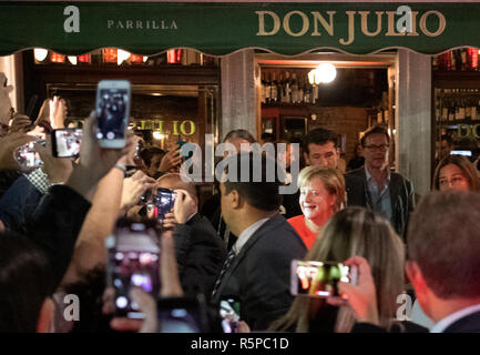 Buenos Aires, Argentina. 02nd Dec, 2018. Federal Chancellor Angela Merkel (CDU, 3rd from right) leaves the steak restaurant 'Don Julio' after the end of the G20 summit meeting. (to dpa 'Angela, Angela': Merkel explores 'Buenos Aires' from 02.12.2018) Credit: Ralf Hirschberger/dpa/Alamy Live News Stock Photo