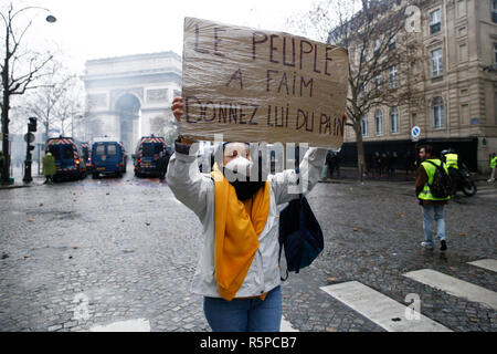 Paris, France.  1st December 2018. People take part in a protest march of the yellow vests  against the rising of the fuel and oil prices. Credit: ALEXANDROS MICHAILIDIS/Alamy Live News Stock Photo