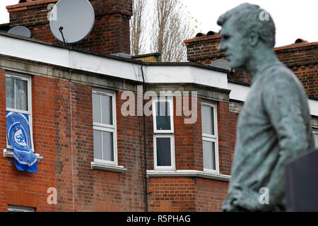 London, UK. 2nd Dec 2018. A Chelsea FC billows in the wind under the view of the Peter Osgood statue during the Premier League match between Chelsea and Fulham at Stamford Bridge, London, England on 2 December 2018. Photo by Carlton Myrie. Credit: UK Sports Pics Ltd/Alamy Live News Stock Photo