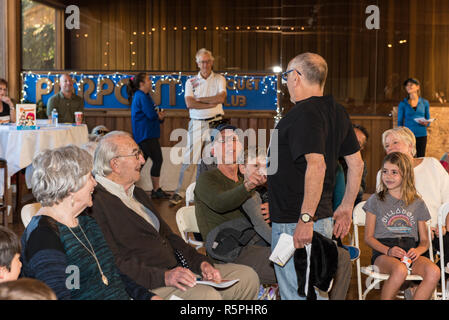California, USA. 1st Dec 2018. Author, Ivor Davis interacting with crowd during book signing at Pierpont Racquet Club in Ventura, California, USA on December 1, 2018. Credit: Jon Osumi/Alamy Live News