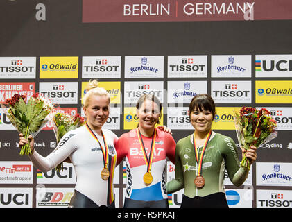 Berlin, Germany. 02nd Dec, 2018. Cycling: Track cycling World Cup in the Velodrom: Final, women, Keirin: Laurine van Rissen (M), Netherlands, Emma Hinze (l), Germany, and Yuka Kobayashi (r), Japan, are happy about their gold, silver and bronze medals respectively. Credit: Soeren Stache/dpa/Alamy Live News Credit: dpa picture alliance/Alamy Live News Stock Photo