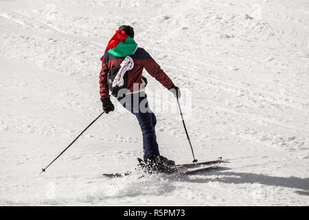 PAMPOROVO, BULGARIA - MARCH 03, 2017 - Skiing with Bulgarian flags at Pamporovo, Bulgaria. People dressed with traditional bulgarian clothes skiing wi Stock Photo