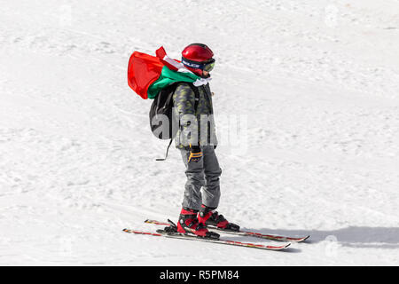 PAMPOROVO, BULGARIA - MARCH 03, 2017 - Skiing with Bulgarian flags at Pamporovo, Bulgaria. People dressed with traditional bulgarian clothes skiing wi Stock Photo