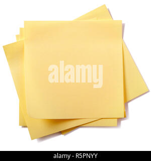 Untidy stack yellow sticky post notes isolated on white Stock Photo