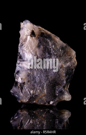 Ancient prehistoric scraper of silex. Neolithic period. Stock Photo