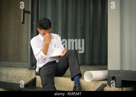 worried businessman sitting after losing job, stressed concept Stock Photo