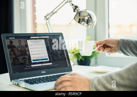 WROCLAW, POLAND - NOVEMBER 29th, 2018: Modern laptop on the desk in office with Linkedin website on the screen. LinkedIn is a business and employment- Stock Photo