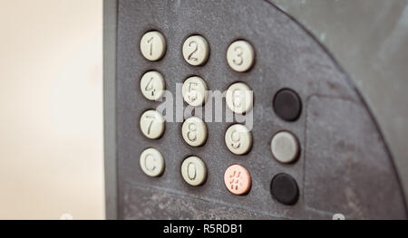 old worn out and dirty keypad on a street Stock Photo