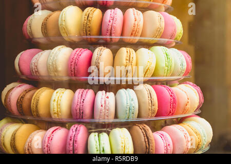 appetizing macarons multicolor in the shop window Stock Photo