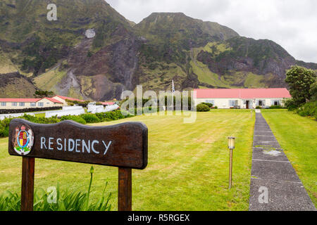 View of British Governor residency, signpost, coat of arms. Edinburgh of the Seven Seas town, Tristan da Cunha, the most remote inhabited island, Sout Stock Photo
