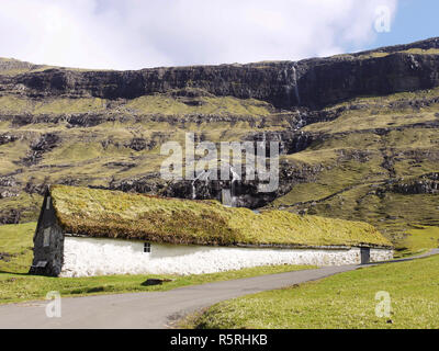Small white  longhouse at Saksun on the Faroe Islands Stock Photo