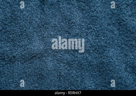 The texture of the fabric with a long nap. Blue textile blank background Stock Photo
