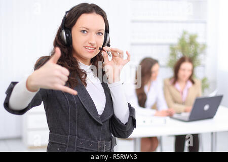 portrait of an employee call center in the background of the of Stock Photo