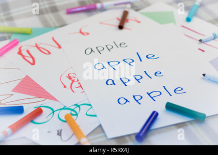 English  Kids Writing Name of the Fruits for Practice Stock Photo