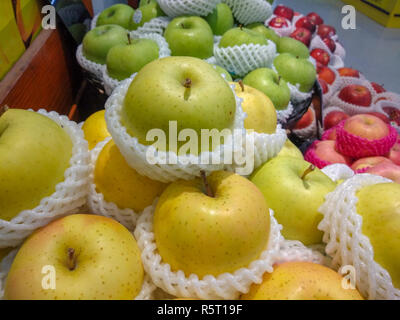 green and yellow apple collection in super market Stock Photo