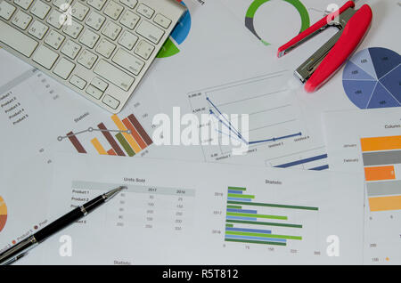 Business document Financial chart and graph and pen with keyboard. Stock Photo