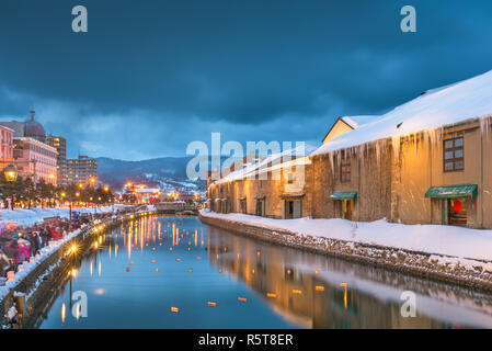 Otaru, Japan winter skyline on the canals during the twilight light up. Stock Photo