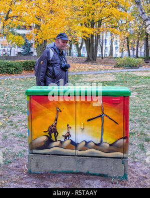 Berlin,Reinickendorf, Utility box with decorative paintwork. Giraffes & sunset painting Stock Photo