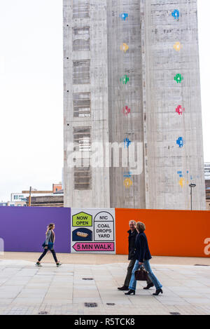 Construction site of Google’s new King’s Cross HQ headquarters  designed by Bjarke Ingels Group and Heatherwick Studios with people walking in front Stock Photo