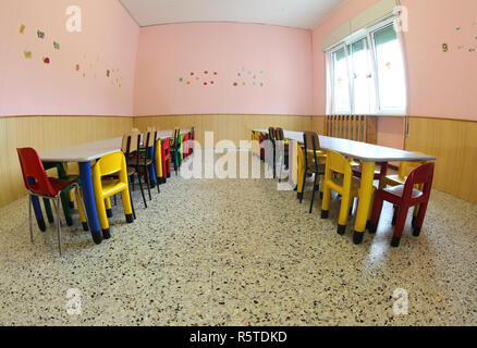 small seats and tables of the nursery without the children Stock Photo