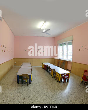 little chairs and tables of a refectory of the kindergarten without the kids Stock Photo