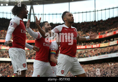 Arsenal's Pierre-Emerick Aubameyang (right) celebrates scoring his side's first goal of the game during the Premier League match at Emirates Stadium, London. Stock Photo