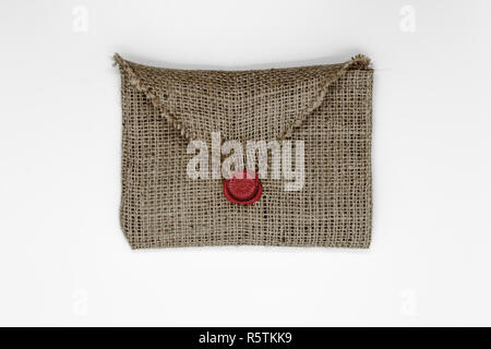 Canvas envelope sealed with red wax and isolated on white background Stock Photo