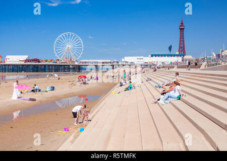 Blackpool beach summer Blackpool tower and central pier Blackpool uk with people on the sandy beach Blackpool Lancashire England UK GB Europe Stock Photo