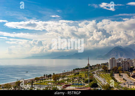 Antalya City Konyaaltı beaches, Beydagları mountains skirt and a cloudy blue sky appears Stock Photo