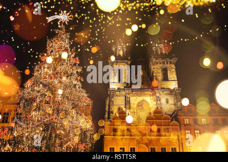 Decorated Christmas tree stands on the main square in Prague during the New Year holidays. Stock Photo