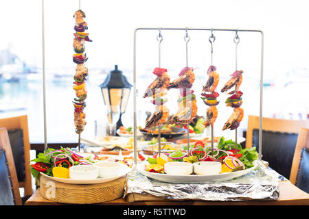 Mediterranean style fresh fish and prawn skewers shish Stock Photo