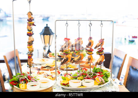 Mediterranean style fresh fish and prawn skewers shish Stock Photo