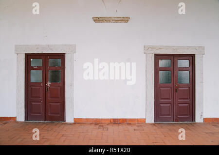 Red weathered wooden doors - Lisbon, Portugal Stock Photo