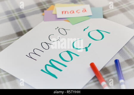 Portuguese  Kids Writing Name of the Fruits for Practice Stock Photo