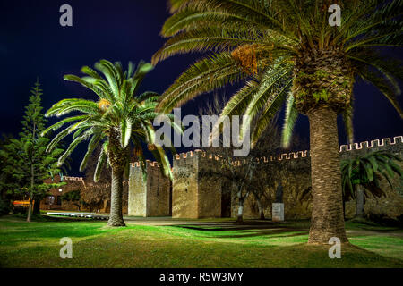 City walls of Lagos, Portugal, illuminated at night Stock Photo