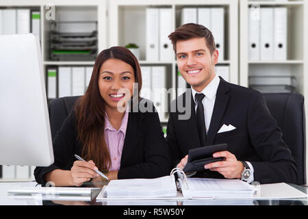Two Accountants Working In Office Stock Photo